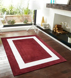 Modern red rug with bold white border and embossed detailing