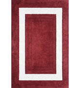 Red and white bordered hand-tufted wool rug with rectangle design