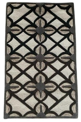 Hand-tufted beige rug with bold black lattice pattern.