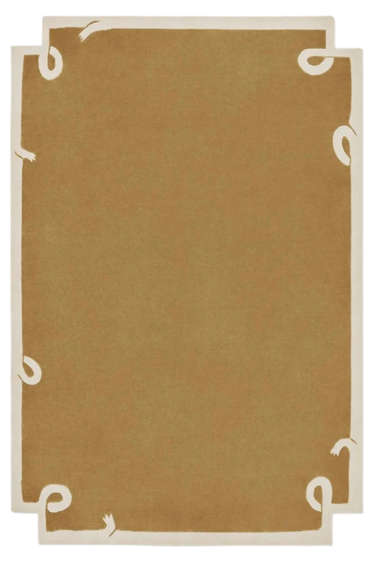 Minimalist camel brown hand-tufted wool rug with ivory border accents.