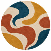 A round area rug with a retro abstract pattern of flowing wavy shapes in cream, mustard yellow, teal blue, terracotta orange, and rust red on a white background.