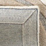 Close-up of luxury handwoven modern rug with geometric patterns and soft neutral tones