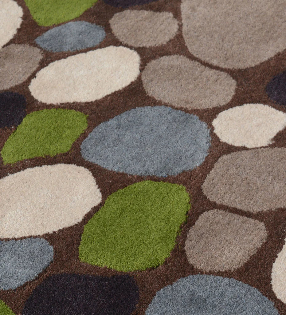 Luxury wool rug featuring rounded stone-like shapes in earthy tones