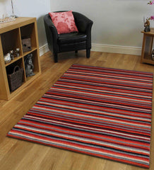 Modern multicolor striped rug in red, orange, grey, and black