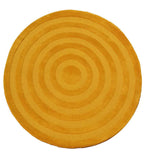 Round mustard yellow rug with concentric circle pattern and textured design