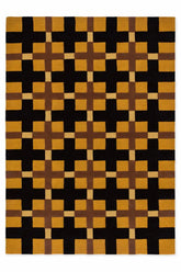 Rug with a geometric pattern of black, brown, and orange squares.