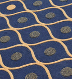 Navy blue rug with beige wavy grid lines and circular geometric patterns