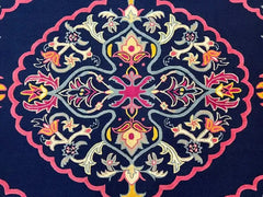 Luxury navy blue handwoven rug with intricate colorful floral and geometric central medallion design