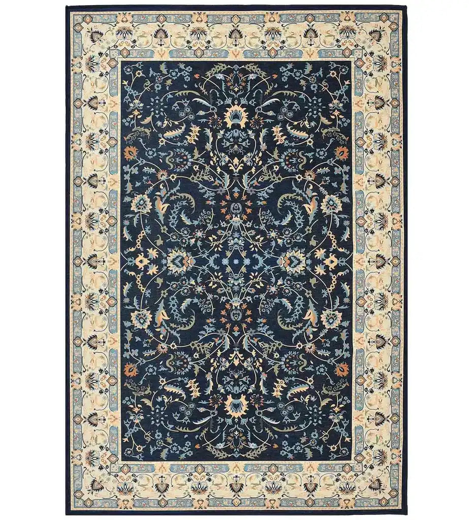 Navy blue traditional rug with intricate floral and vine patterns and beige decorative border