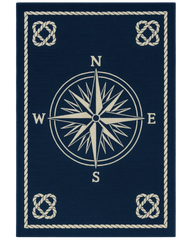 Navy blue and beige nautical rug with compass design.