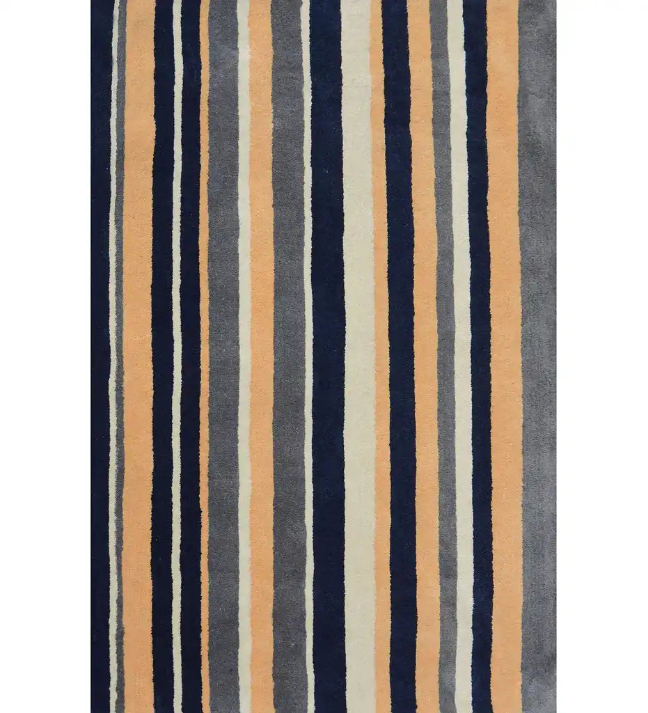 Navy blue, beige, and gray hand-tufted wool rug with vertical stripes.