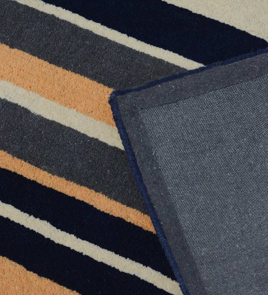 Modern wool rug with navy and beige stripes for elegant interiors.