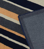 Modern wool rug with navy and beige stripes for elegant interiors.