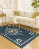 Hand-tufted wool nautical rug featuring compass and rope border.