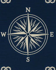 Coastal-style navy wool rug with beige compass pattern.