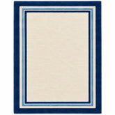 A rectangular area rug with a cream center and a thick navy blue border accented with thin light blue stripes, shown flat against a white background.