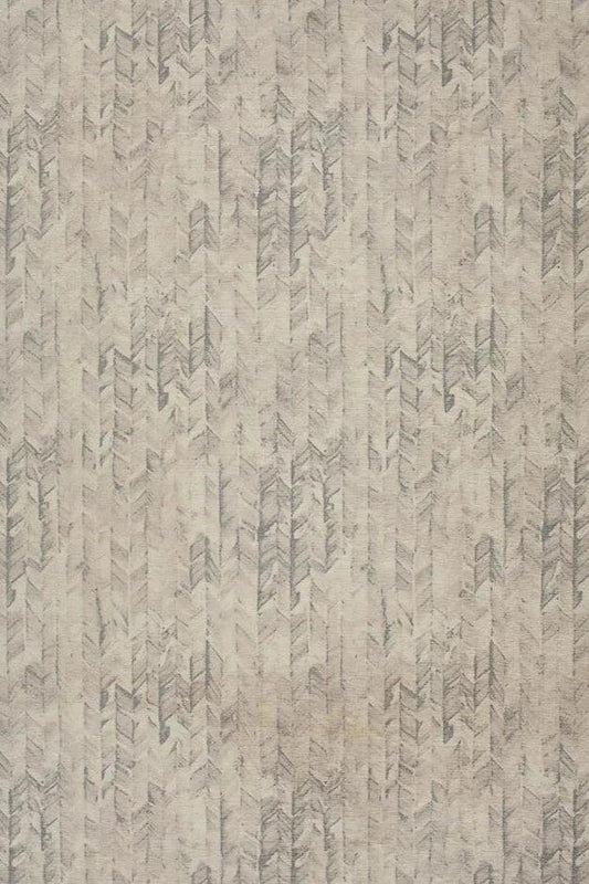 Neutral chevron rug in machine washable fabric.