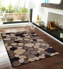 Neutral color wool rug with pebble pattern on wooden floor in bright modern living room
