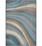 Neutral wave earth tone abstract rug in beige and taupe.
