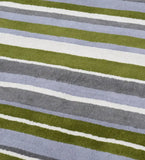 Hand-tufted wool area rug featuring soft modern stripe design.