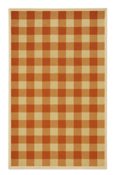 Machine washable orange gingham plaid rug for farmhouse fall decor.