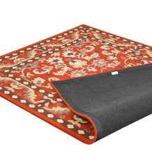 Orange hand-tufted rug with traditional heritage floral design