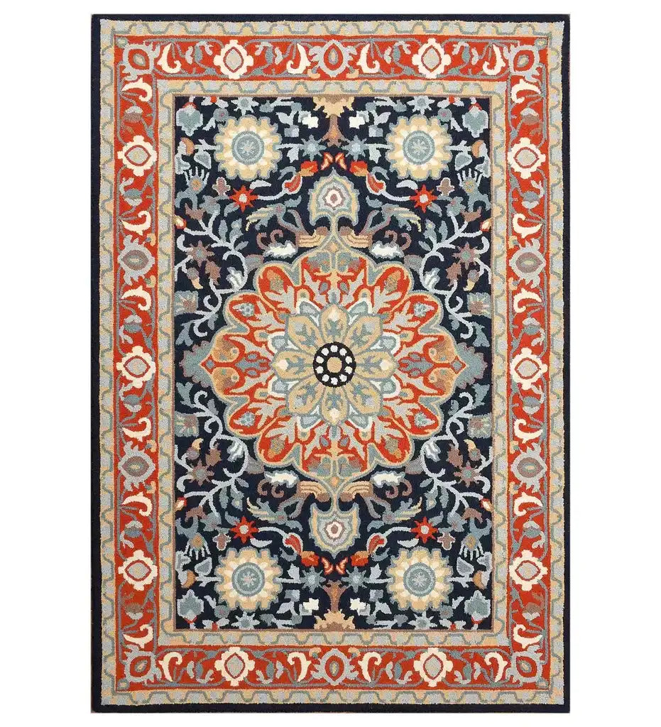 Hand-tufted rectangular rug with traditional floral medallion design in orange, blue, and beige