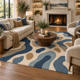 Blue and beige geometric area rug styled in a modern living room, 9x12 size