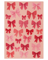 Pink Christmas rug with hand-tufted bow pattern design.
