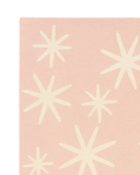 Soft pink wool rug with cream starburst accents for Christmas styling