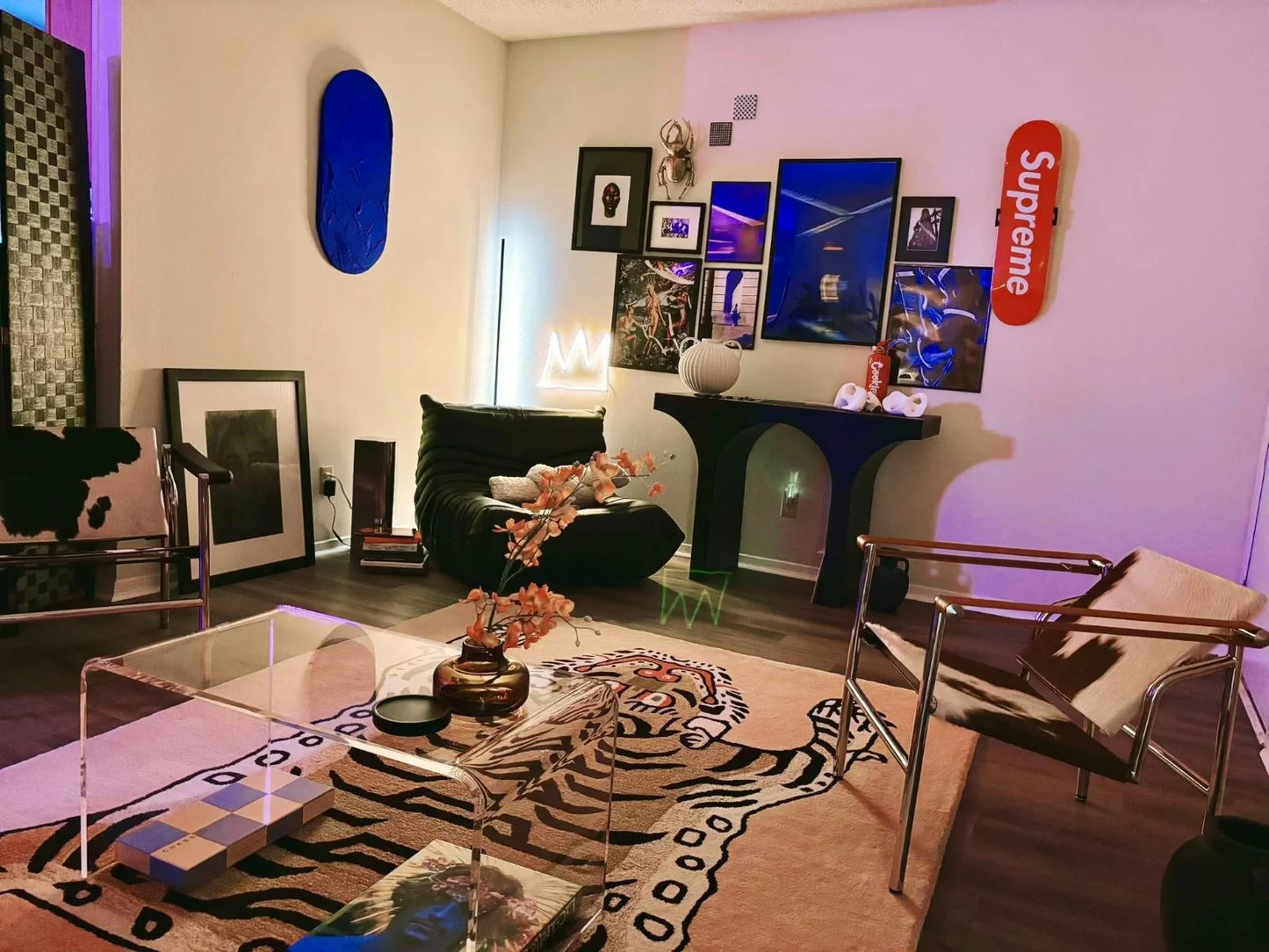 Modern living room with stylish decor, furniture, and artwork.