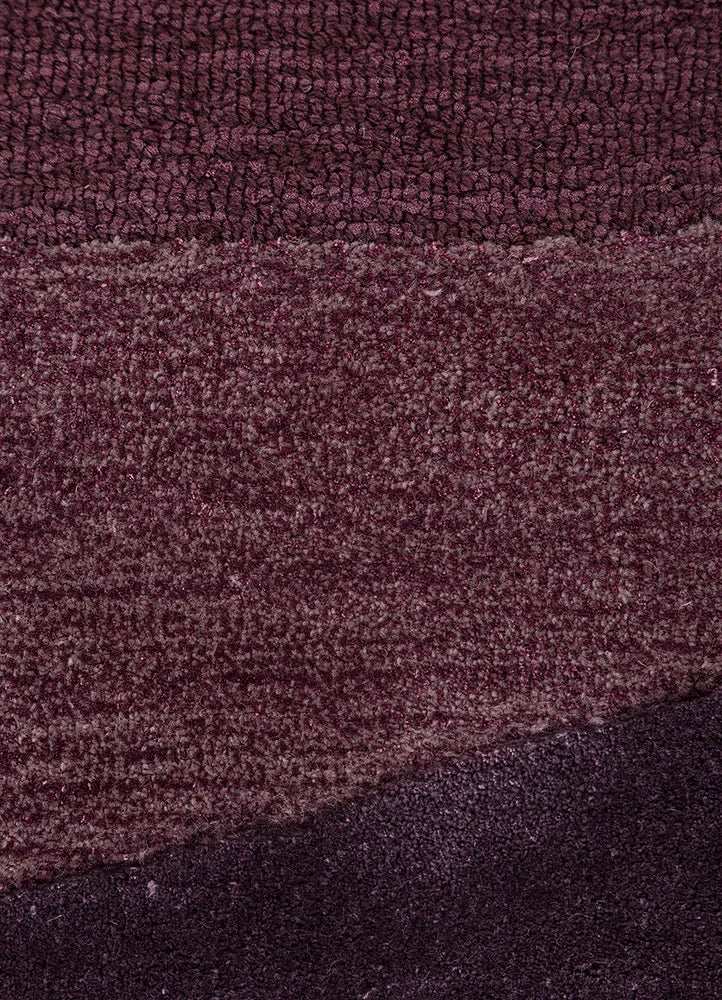 Purple modern rug with textured plum wave pattern and varying pile heights