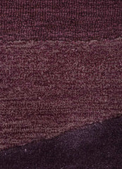 Purple modern rug with textured plum wave pattern and varying pile heights
