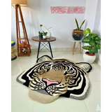 Handwoven tiger face wool rug in modern living room with plants, table, and floor lamp