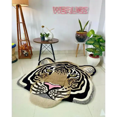 Handwoven tiger face wool rug in modern living room with plants, table, and floor lamp