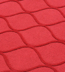 Luxury wool rug in solid red with raised geometric details