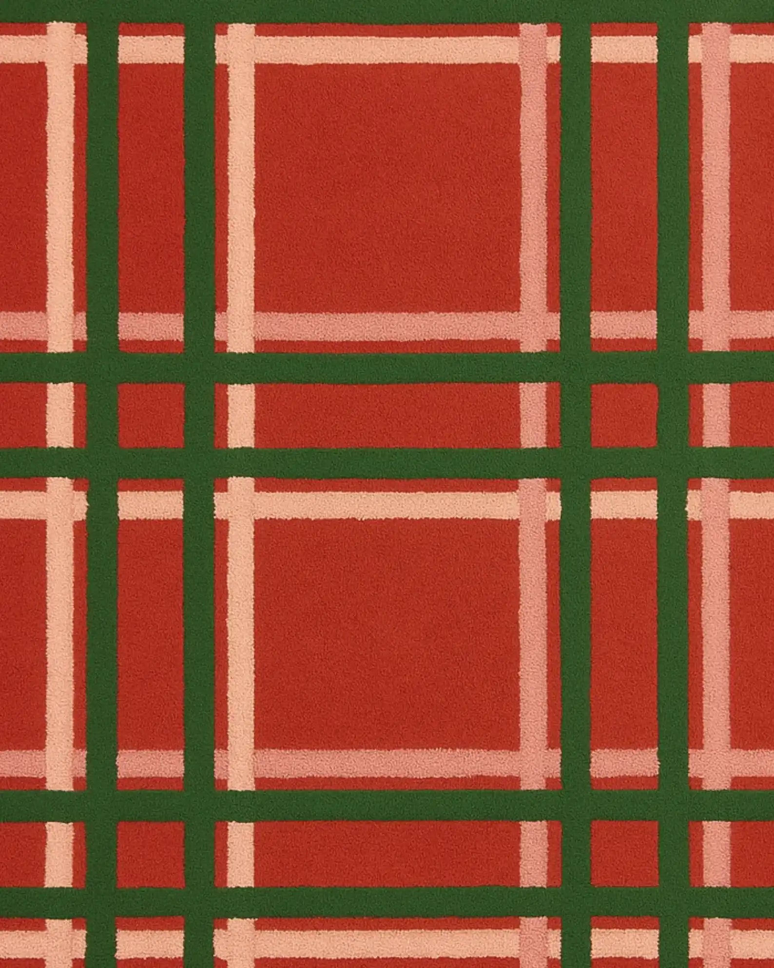 Red and green tartan Christmas rug for seasonal décor.
