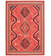 Red tribal rug with bold geometric motifs.