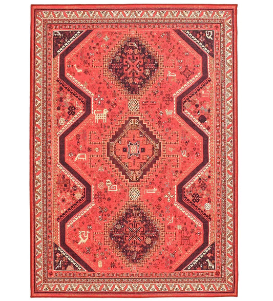 Red tribal rug with bold geometric motifs.