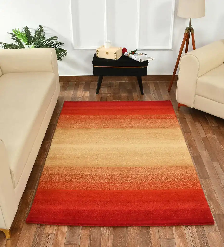 Modern ombre rug transitioning from deep red to golden beige