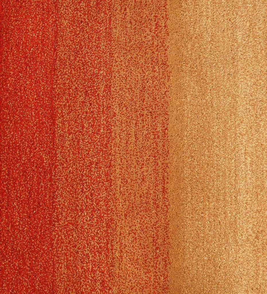 Luxury wool rug with gradient red, orange, and beige tones