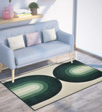 Modern living room with light blue sofa and retro geometric arch rug in green and cream tones