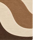 Close-up of brown flowing wave pattern on cream wool rug for a bedroom, 6x9 size