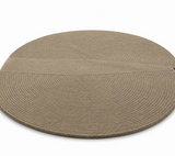 Round braided rug on a white background