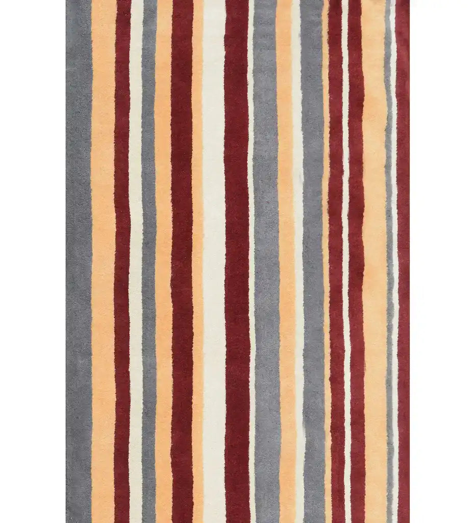 Rust red, mustard, and gray hand-tufted wool rug with modern vertical stripes.
