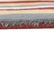 Contemporary hand-tufted wool rug in rust and grey vertical pattern.