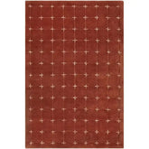 Hand-tufted rustic red wool rug with cream grid pattern.