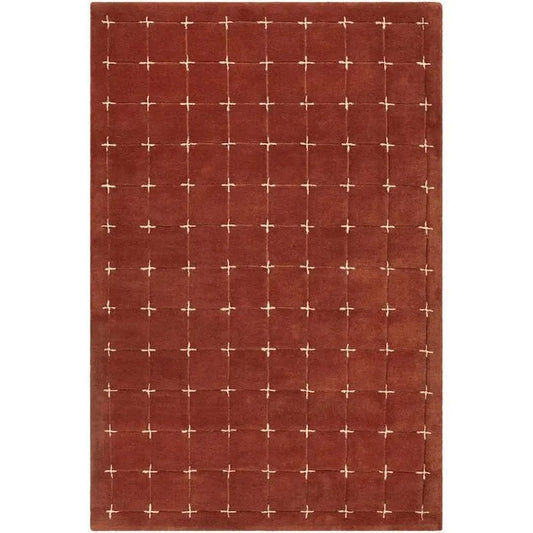 Hand-tufted rustic red wool rug with cream grid pattern.