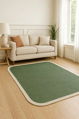 Sage green rug with cream border and hand tufted