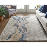 Luxury hand tufted rug with abstract blue and beige pattern in modern living room